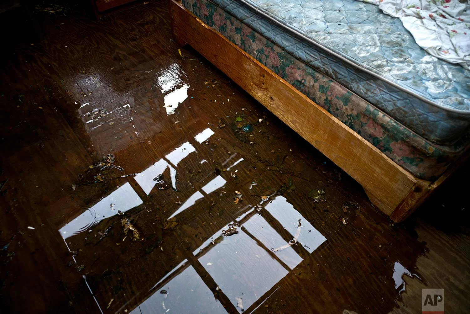A soaked bed sits in a roam damaged by the passage of hurricane Maria in the San Lorenzo neighborhood of Morovis, Puerto Rico, Saturday, Sept. 30, 2017. (AP Photo/Ramon Espinosa)