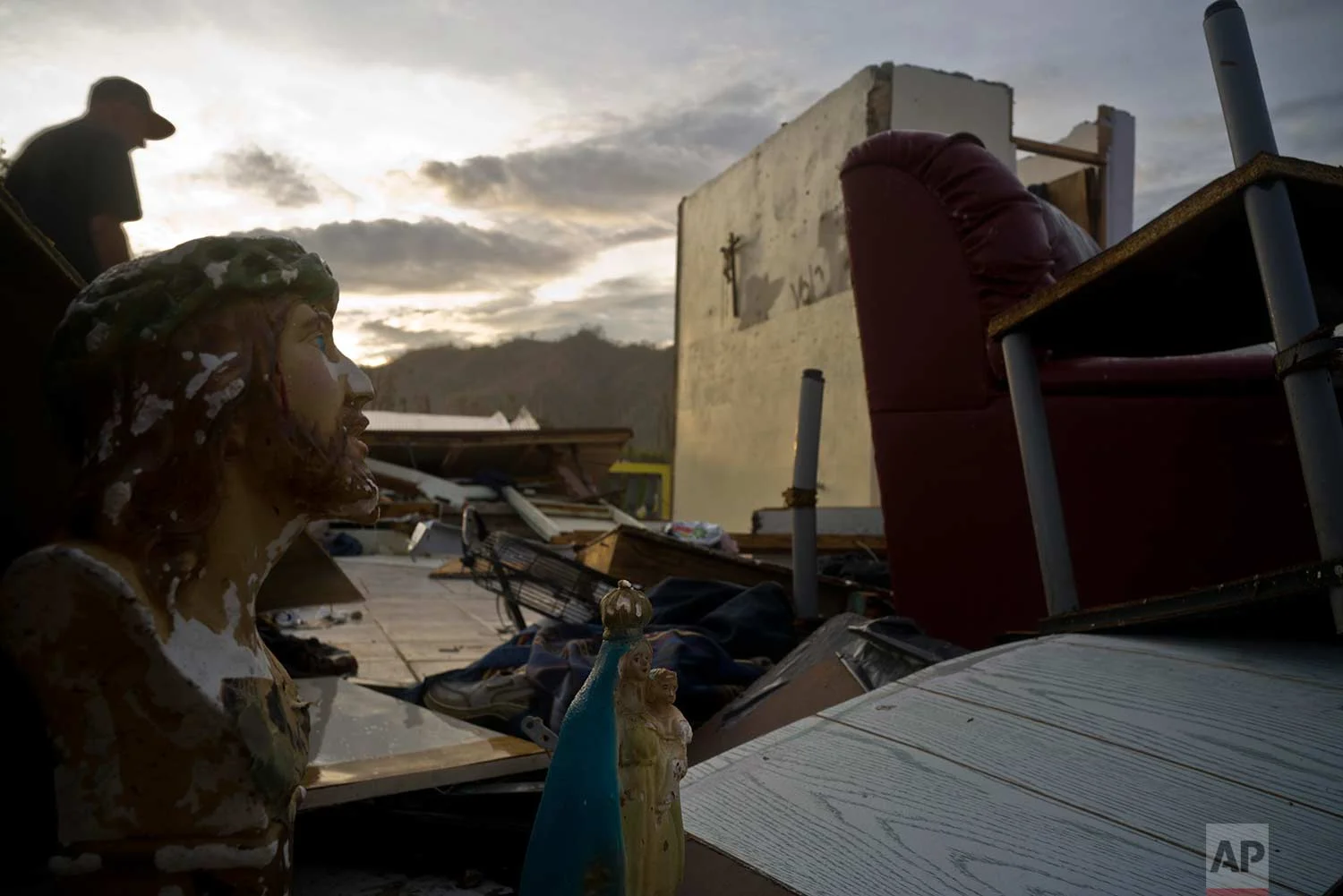 Luis Cosme walks in the remains of his house destroyed by Hurricane Maria, in Morovis, Puerto Rico, Sunday, Oct. 1, 2017. (AP Photo/Ramon Espinosa)