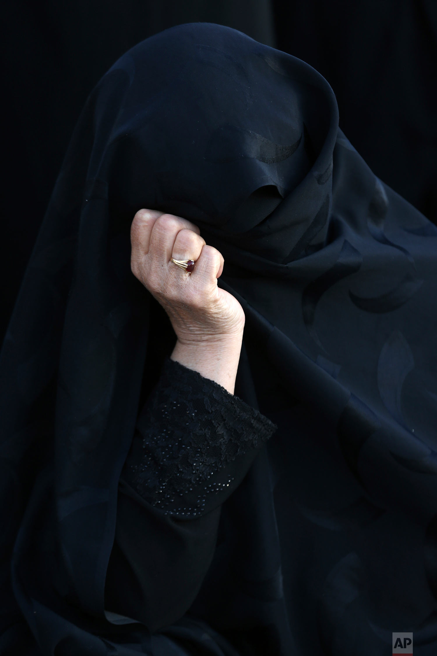  An elderly woman takes part in a procession during the Muslim month of Muharram, an important period of mourning for Muslim Shiites which marks the anniversary of martyrdom of Imam Hussein, a grandson of Prophet Muhammad and the third Shiite saint, 