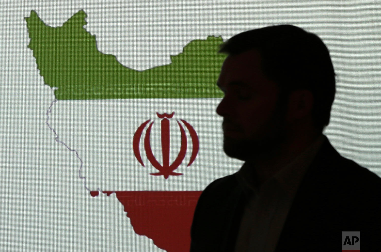 Stuart Davis, a director at one of FireEye's subsidiaries, stands in front of a map of Iran as he speaks to journalists about the techniques of Iranian hacking, Wednesday, Sept. 20, 2017, in Dubai, United Arab Emirates. (AP Photo/Kamran Jebreili)