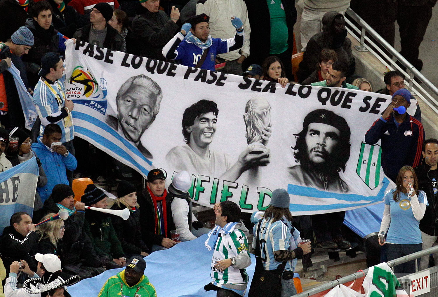  Argentina fans hold up a banner with images of former President Nelson Mandela, Diego Maradona and Che Guevara during the World Cup round of 16 soccer match between Argentina and Mexico at Soccer City in Johannesburg, South Africa, Sunday, June 27, 