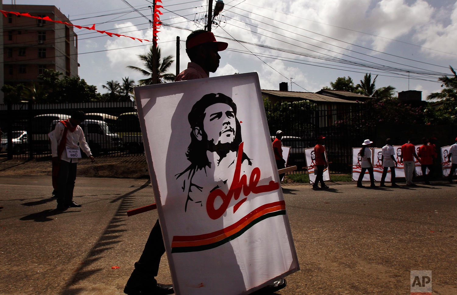  Activists of Sri Lanka's Marxist political party, People's Liberation Front carry posters of Che Guevara during a street march to celebrate international Labor Day known as May Day in Colombo, Sri Lanka, Tuesday, May 1, 2012.&nbsp; (AP Photo/Gemunu 