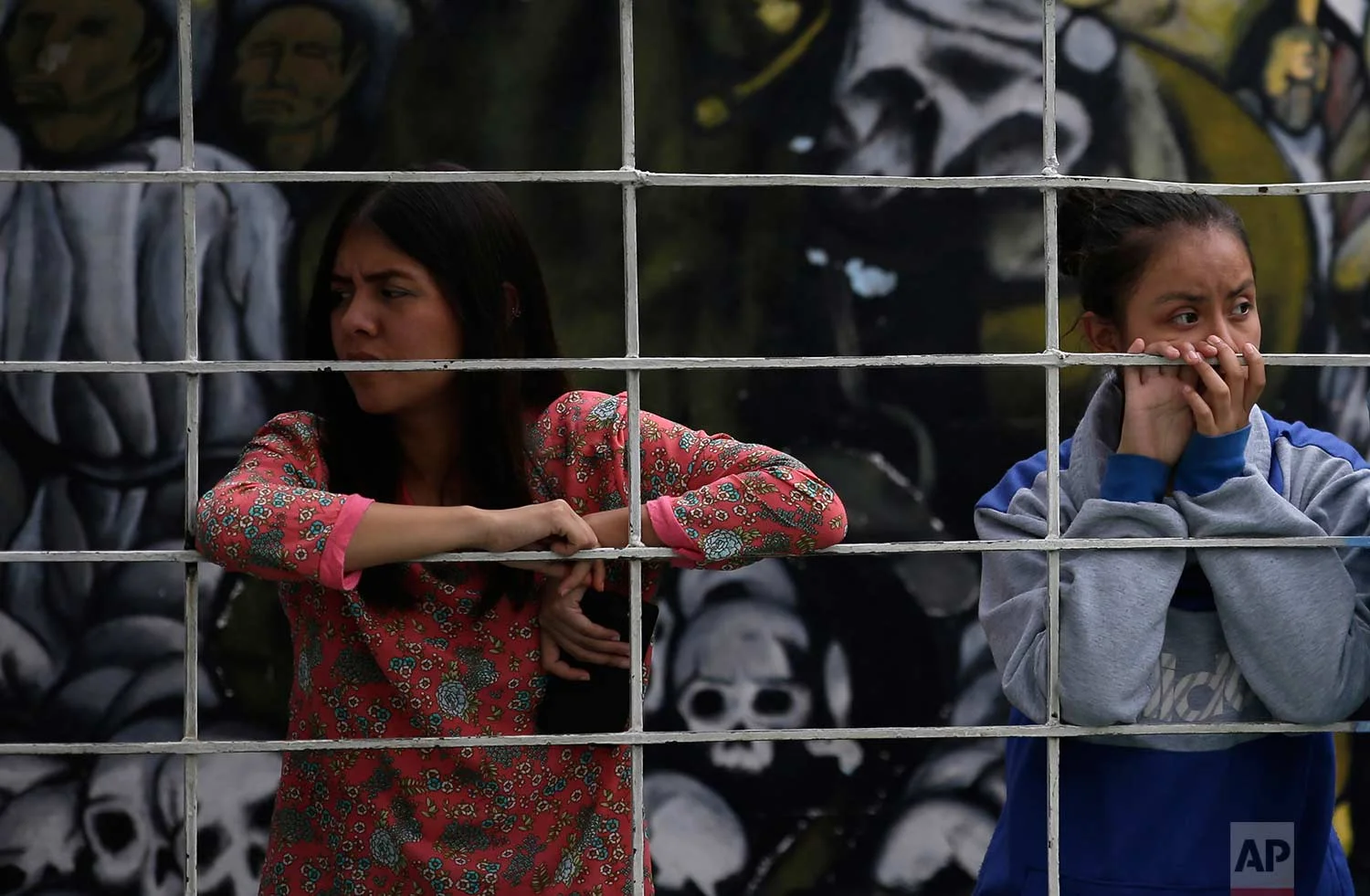 In this Aug. 25, 2017 photo, female students at a nursing school look on during a self-defense workshop led by Muay Thai practitioners in Nezahualcoyotl, Mexico state. (AP Photo/Rebecca Blackwell)