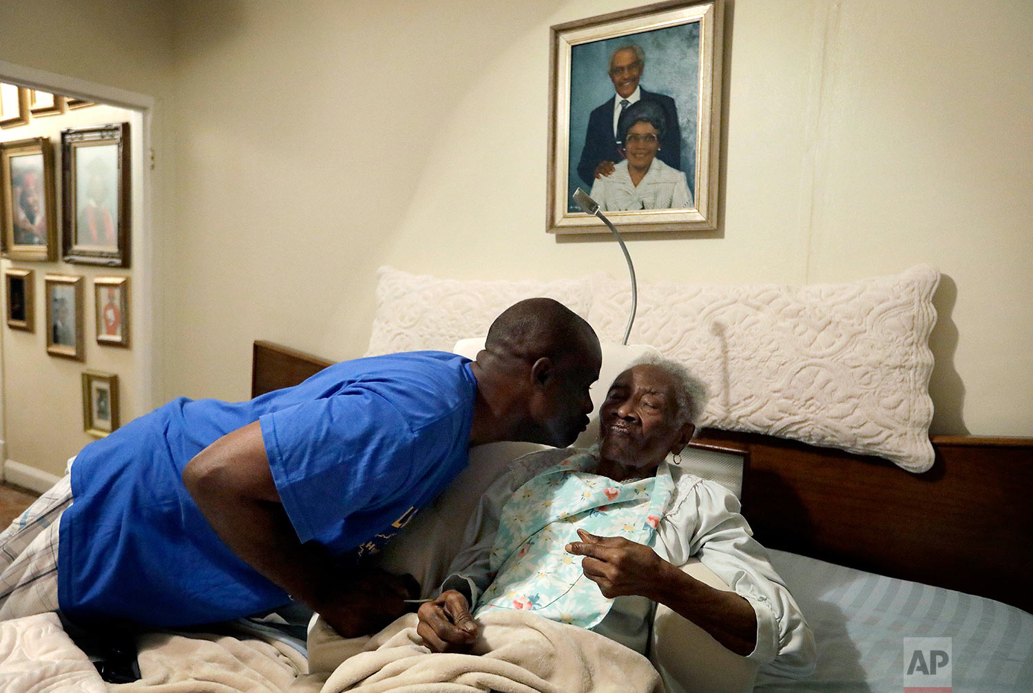  Greg Gunner, left, kisses his grandmother Mabel Bishop, 99, on Tuesday, Sept. 26, 2017 in Port Arthur, Texas, in their home that was damaged by Hurricane Harvey. Gunner carried his grandmother, stricken with Alzheimer's disease, out of the house as 