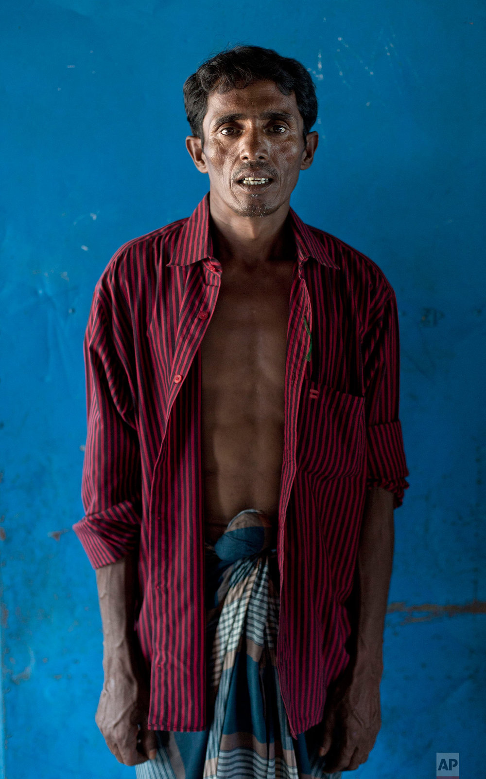  In this Oct. 1, 2017, photo forty-year-old Mohamed Kasim, from Myanmar's Moidaung Village, stands for a photograph at a transit shelter at Kutupalong camp for newly arrived Rohingya refugees in Bangladesh. . Kasim's wife and two daughters drowned wh