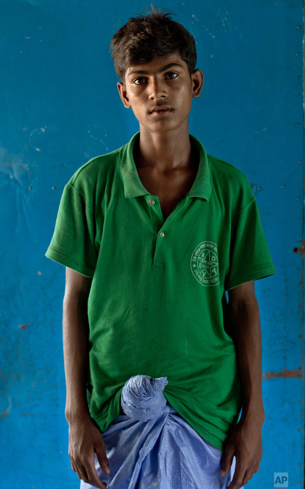  In this Oct. 1, 2017, photo, 16-year-old Abdul Rashid, from Myanmar's Moidaung village, poses for a photograph at a transit shelter at Kutupalong camp for newly arrived Rohingya refugees in Bangladesh. Abdul's mother drowned when the boat she was tr