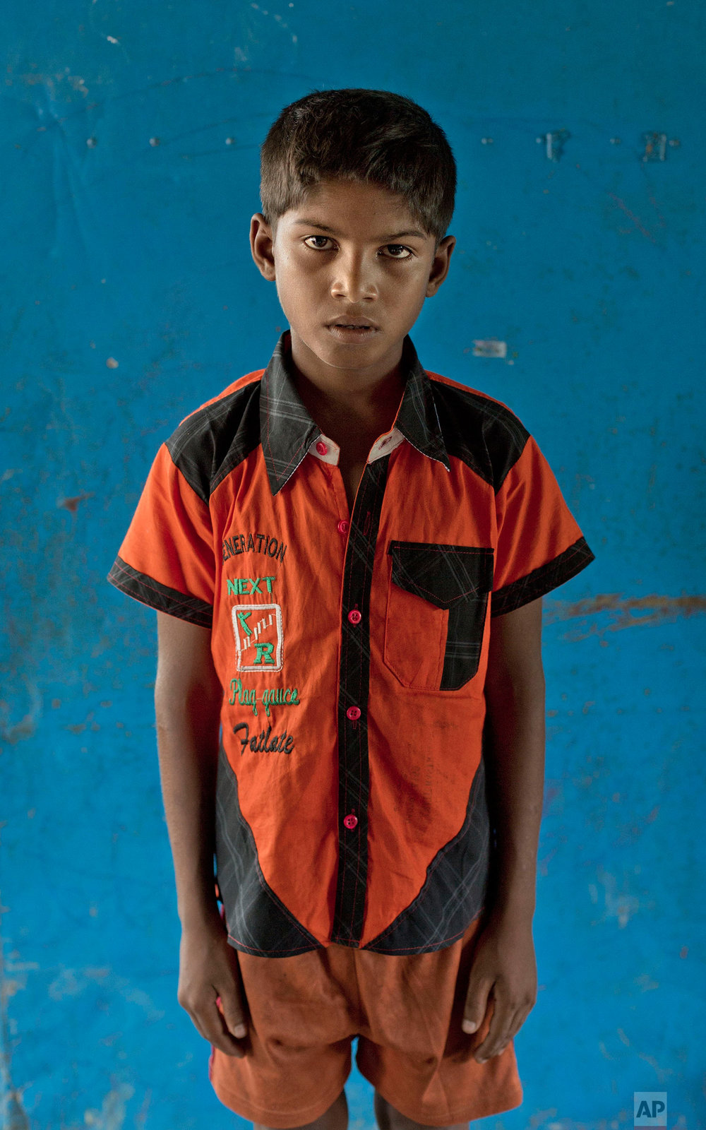  In this Oct. 1, 2017, photo nine-year-old Abdul Rakhim, from Myanmar's Moidaung village, poses for a photograph at a transit shelter at Kutupalong camp for newly arrived Rohingya refugees in Bangladesh. Abdul's mother drowned when the boat she was t