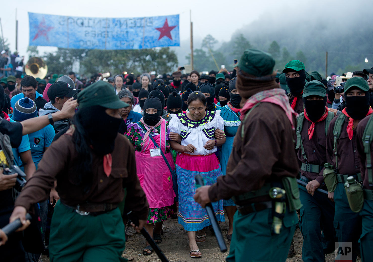  In this Sunday, Oct. 15, 2017 photo, presidential candidate for the National Indigenous Congress, Maria de Jesus Patricio, is escorted by Zapatistas at her campaign rally in the Zapatista stronghold of Morelia, in the southern state of Chiapas, Mexi