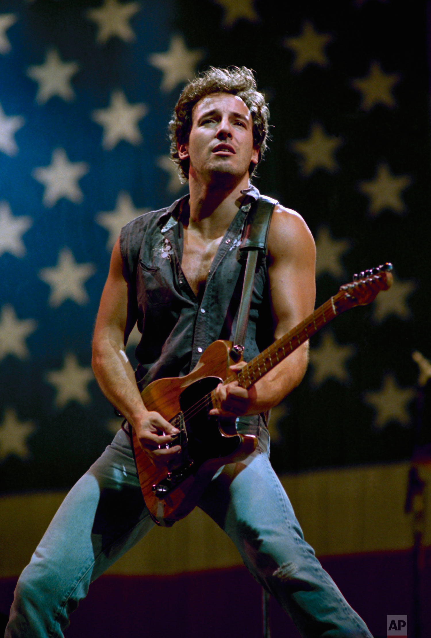  U.S. performer Bruce Springsteen plays his Fender Telecaster guitar while singing his hit song "Born in the U.S.A." as he completed his world tour at Los Angeles Memorial Coliseum in September 1985. (AP Photo/Lennox McLendon) 