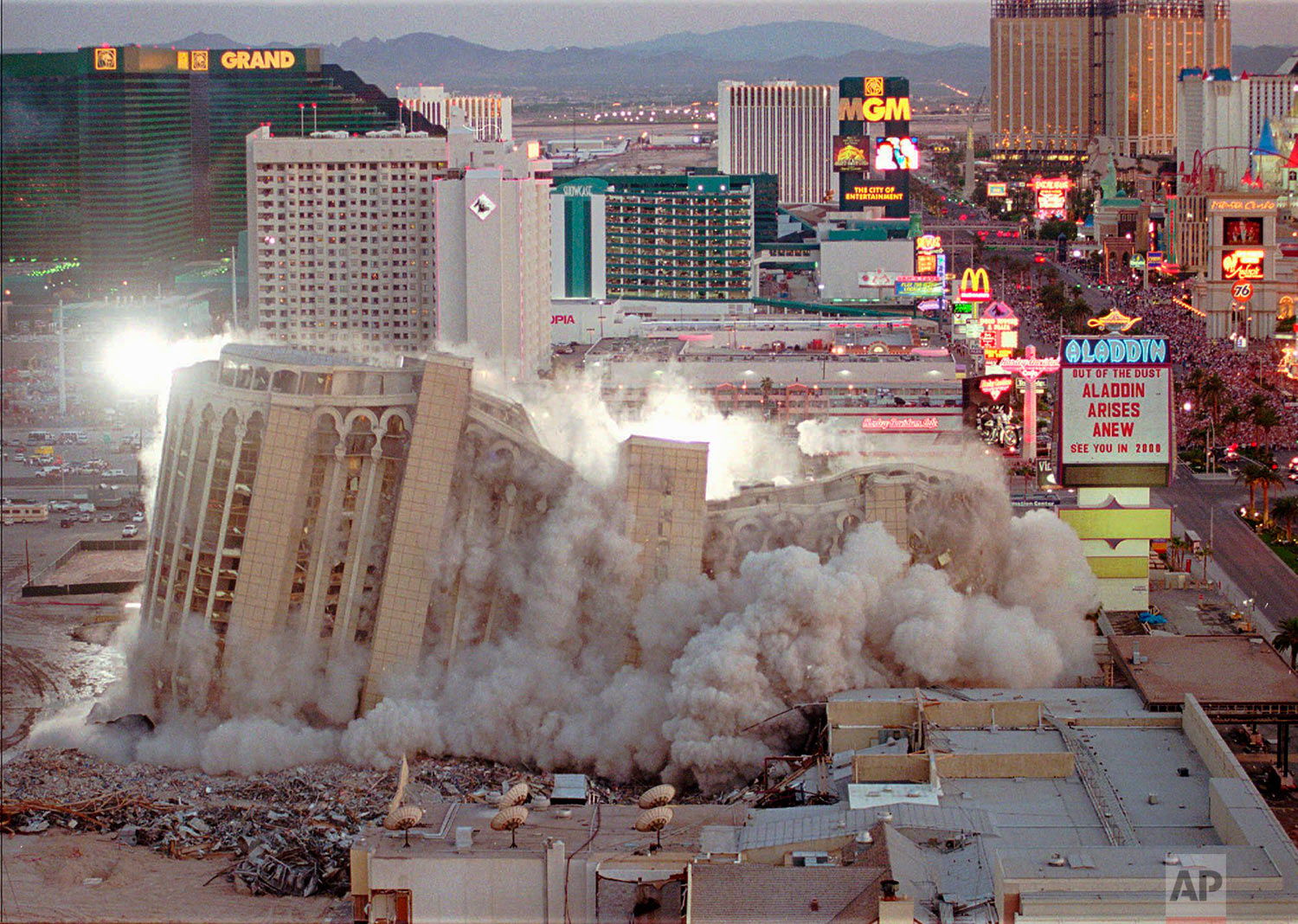  In this April 27, 1998, photo, taken by Associated Press photographer Lennox McLendon, shows the Aladdin Hotel & Casino comes tumbling down as it is imploded in Las Vegas. The Aladdin, built in 1966, was imploded to make way for the $1.3 billion Ala