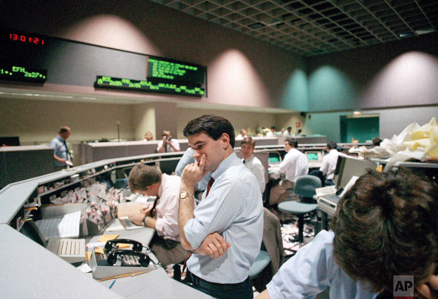  Securities specialist assistant Spencer Varian of Wedbush Securities Co., looks dejected as he watches stock prices plunge on his computer terminal, Oct. 19, 1987, in Los Angeles at the Pacific Stock Exchange. The Pacific Exchange was one of many ar