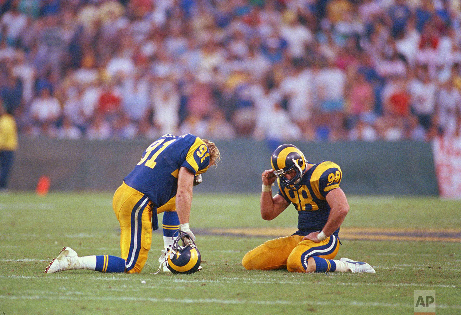  Los Angeles Rams defenders Kevin Greene, left, and Shawn Miller react after the New England Patriots quarterback Tony Eason threw a desperation pass in the end zone with time running out to defeat the Rams 30-28, Nov. 16, 1986, in Anaheim. Patriots 