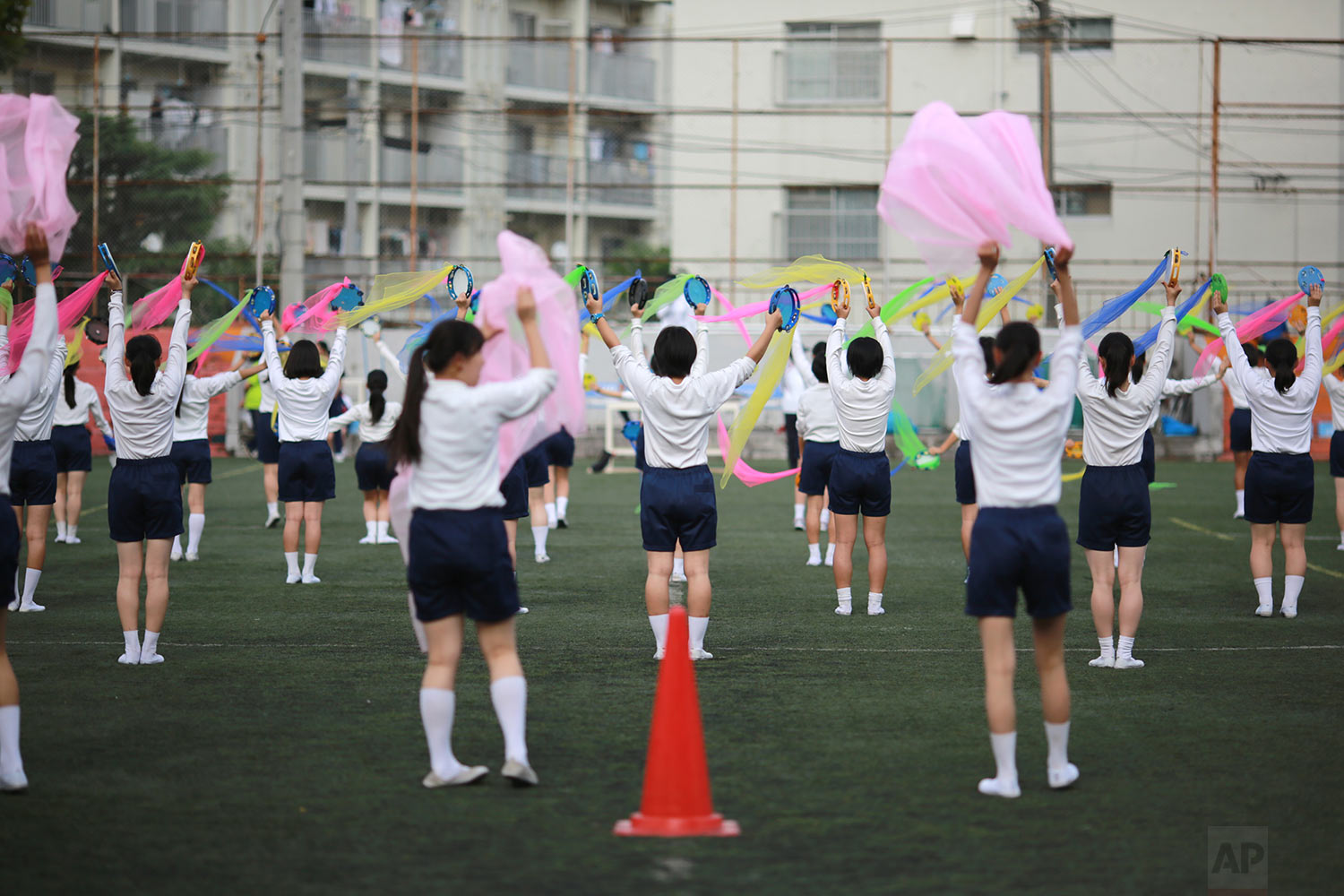  In this Sept. 26, 2017, photo, students practice flag cheering routines at a Korean high school in Tokyo. Many third- and fourth-generation descendants of Koreans brought to Japan during the imperialist years before and during World War II remain lo