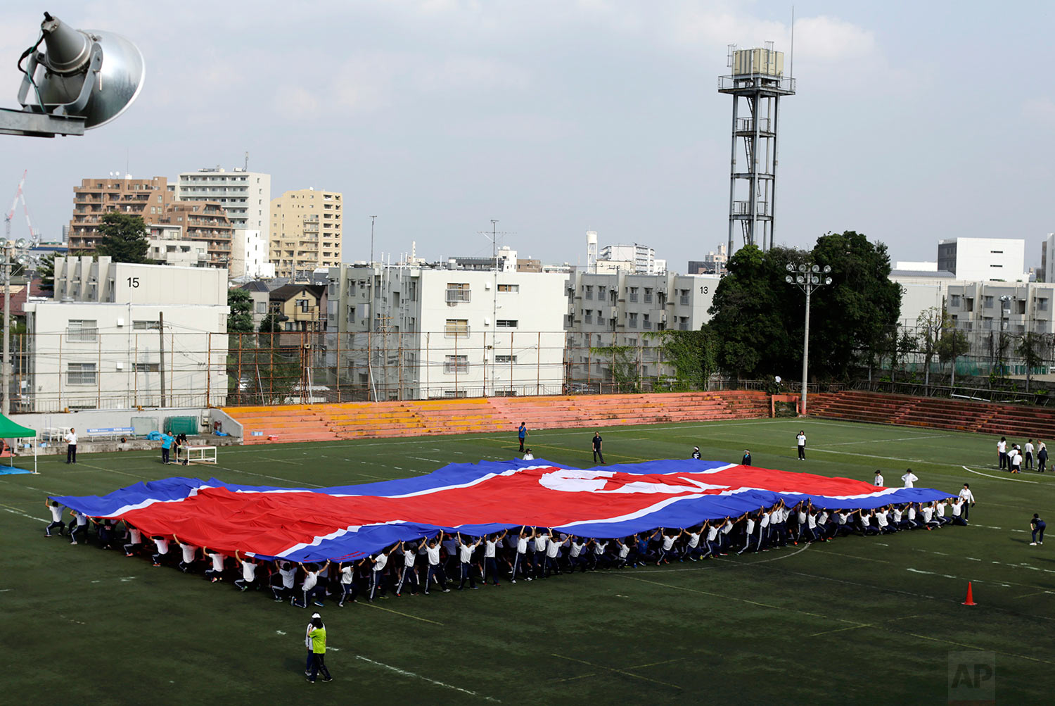  In this Sept. 26, 2017, photo, students practice forming the North Korean flag during a performance at a Korean high school in Tokyo. (AP Photo/Eugene Hoshiko) 