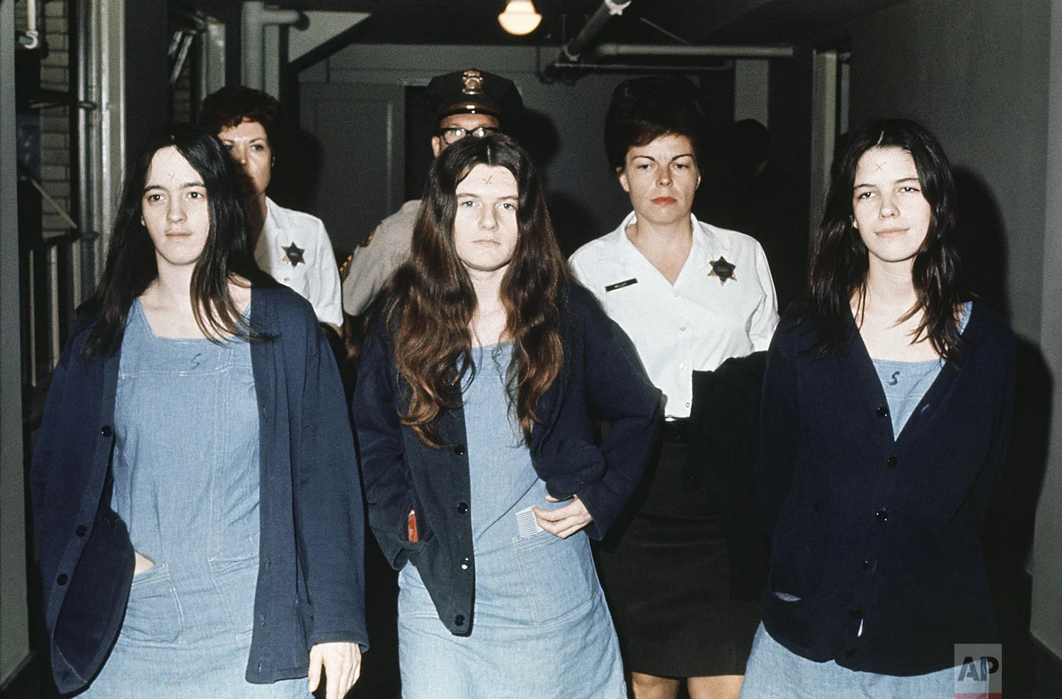 Three female defendants in the Manson court case are shown, from left to right: Susan Atkins, Patricia Krenwinkel, Leslie Van Houten, March 29 , 1971 as they return to court to hear the penalty ending a nine-month trial in the Tate-LaBianca murders of August 1969. All three, plus Charles Manson, were decreed the death sentence in the gas chamber. (AP Photo)