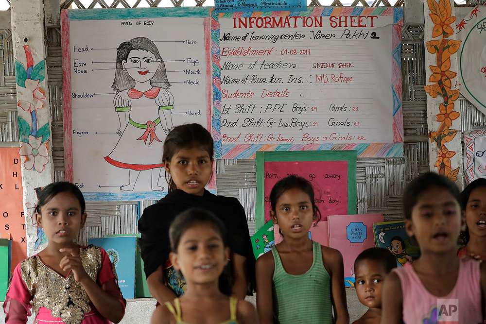  Rohingya Muslim children recite poems in a makeshift school at the Thaingkhali refugee camp on Wednesday, Nov. 22, 2017, in Bangladesh. Since late August, more than 620,000 Rohingya have fled Myanmar's Rakhine state into neighboring Bangladesh, seek