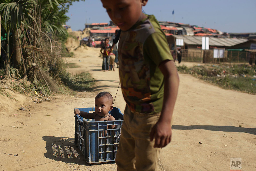  Rohingya Muslim children race make-shift carts made with plastic crates around Jamtoli refugee camp in Bangladesh on Monday, Nov. 27, 2017. Since late August, more than 620,000 Rohingya have fled Myanmar's Rakhine state into neighboring Bangladesh, 