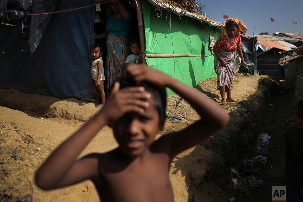  A Rohingya boy plays outside his family's tent in Kutupalong refugee camp on Saturday, Nov. 25, 2017, in Bangladesh.  The United Nations and others have said the military's actions appeared to be a campaign of "ethnic cleansing," using acts of viole