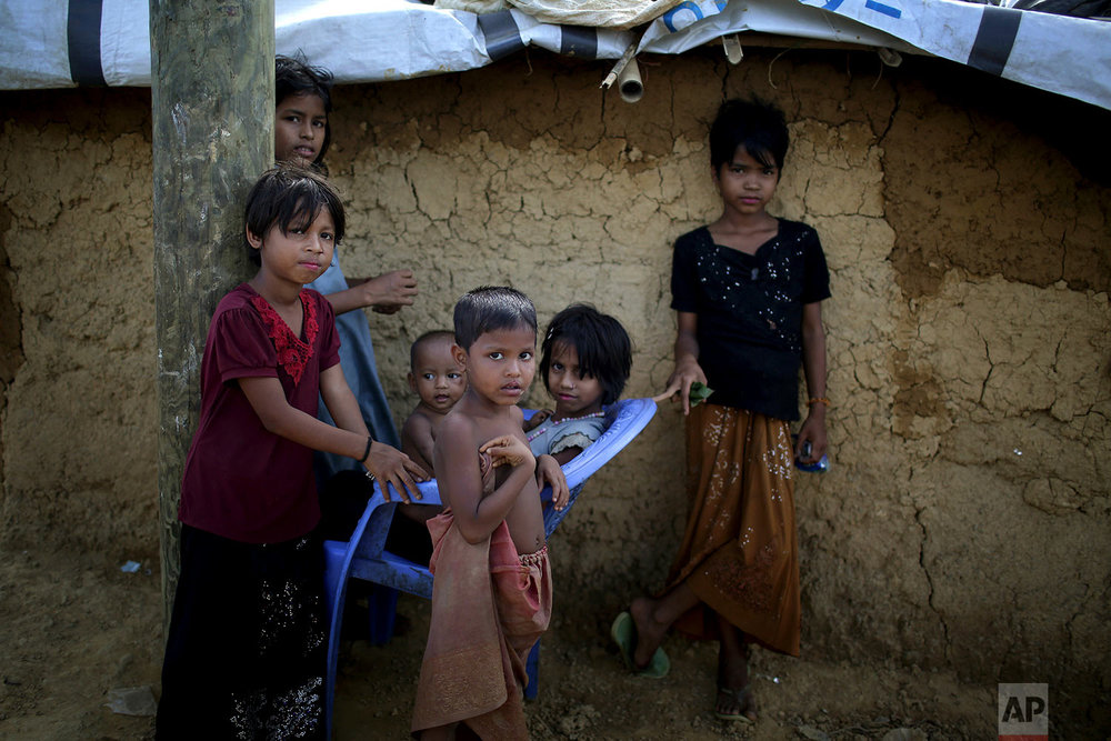  In this Sunday, Nov. 19, 2017, photo, Rohingya Muslim children sit together in Kutupalong refugee camp in Bangladesh. More than 620,000 Rohingya have fled Rakhine for neighbouring Bangladesh since late August 2017, when the military launched what it