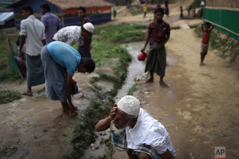  A Rohingya Muslim man washes his face before Friday prayers outside a makeshift mosque in Jamtoli refugee camp on Friday, Nov. 24, 2017, in Bangladesh. Since late August, more than 620,000 Rohingya have fled Myanmar's Rakhine state into neighboring 