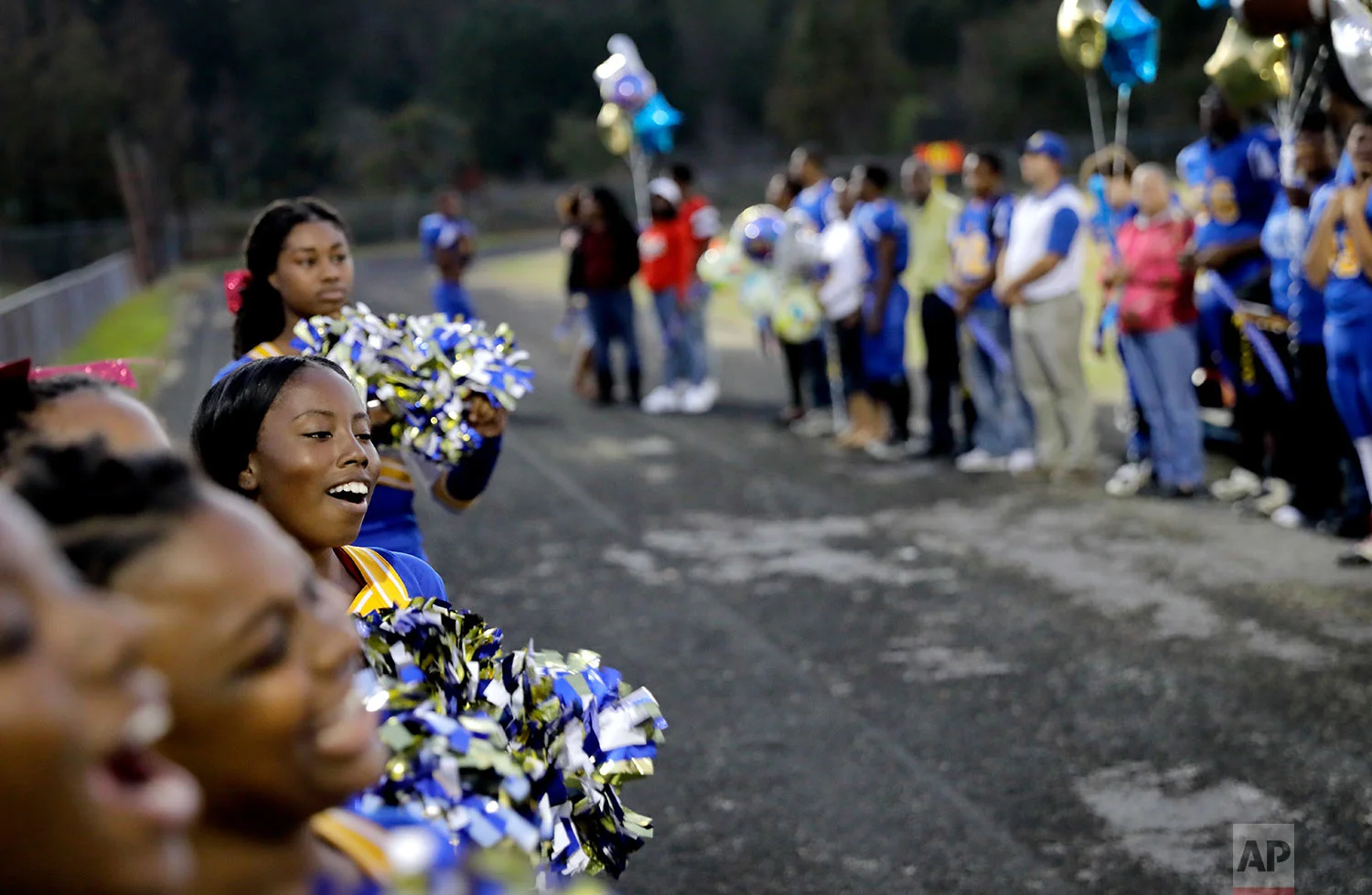 South Robeson High School cheerleader Amare Leach cheers before a football game in Rowland, N.C., Friday, Oct. 27, 2017. (AP Photo/David Goldman)