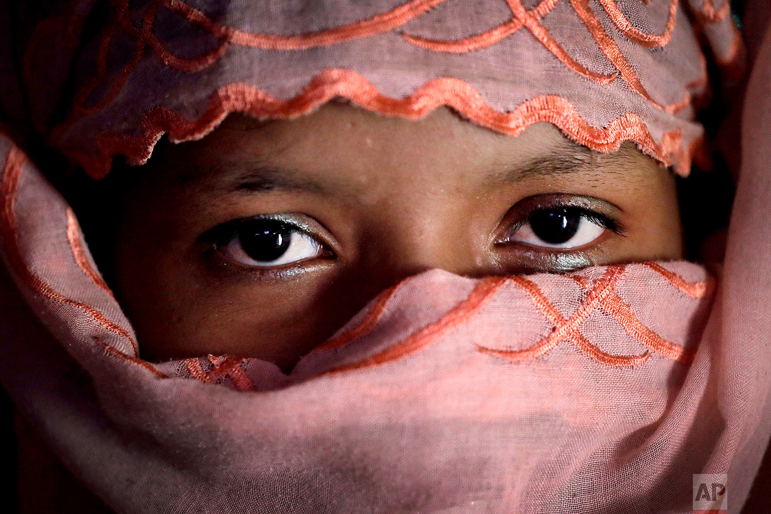  In this Sunday, Nov. 19, 2017, photo, R, 13, who says she was raped by members of Myanmar's armed forces in late August, is photographed in her family's tent in Kutupalong refugee camp in Bangladesh. (AP Photo/Wong Maye-E) 