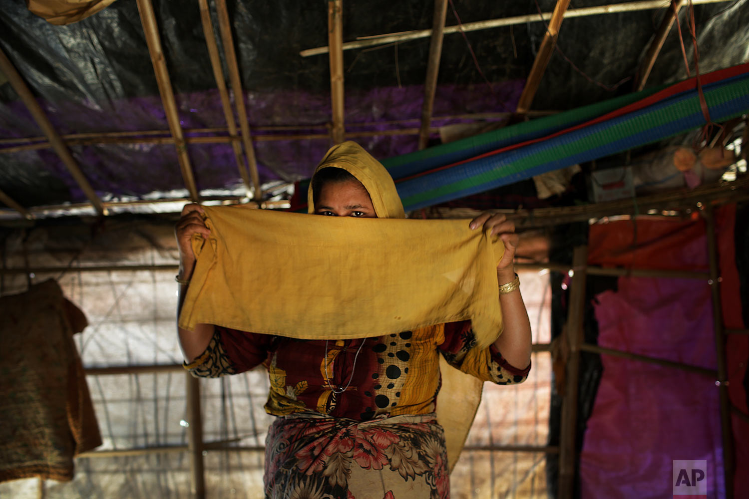  In this Tuesday, Nov. 21, 2017, photo, M, 25, mother of four, who says she was raped by members of Myanmar's armed forces in late August, is photographed in her tent in Kutupalong refugee camp in Bangladesh.  (AP Photo/Wong Maye-E)




 