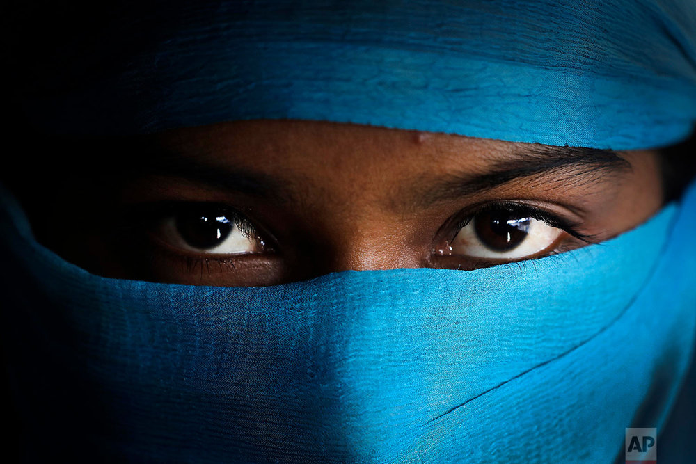  In this Wednesday, Nov. 22, 2017, photo, N, 17, who says she was raped by members of Myanmar's armed forces in late August, is photographed in her tent in Kutupalong refugee camp in Bangladesh.  (AP Photo/Wong Maye-E)



 