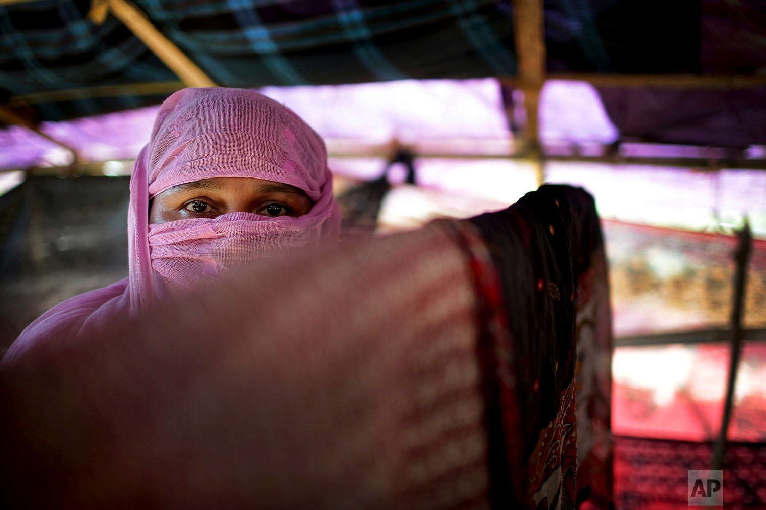  In this Monday, Nov. 20, 2017, photo, M, 30, mother of four, who says she was raped by members of Myanmar's armed forces in late August, is photographed in her tent in Kutupalong refugee camp in Bangladesh.  (AP Photo/Wong Maye-E)




 