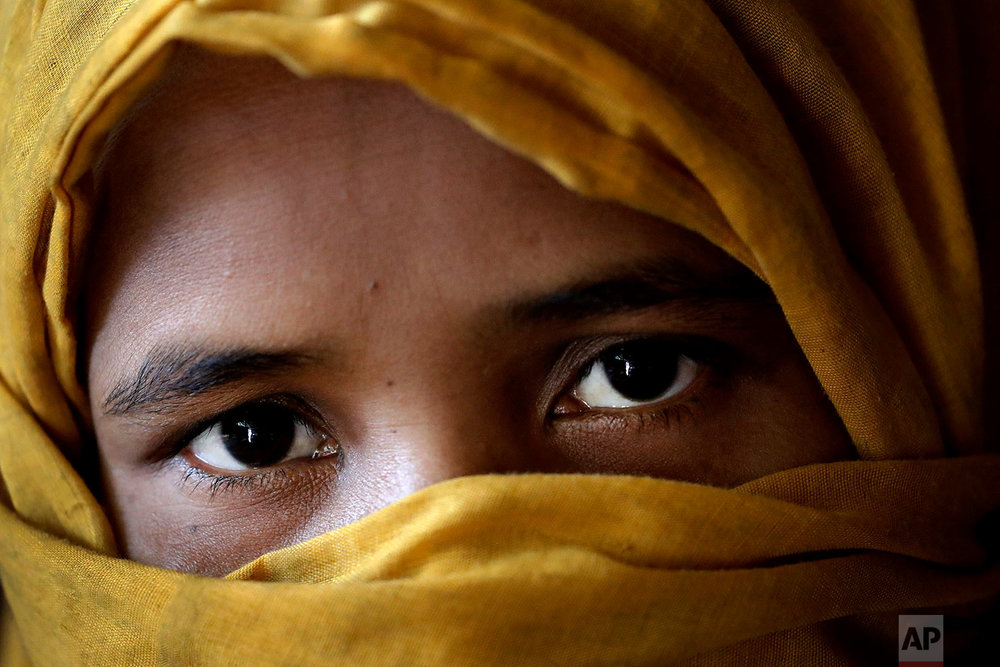  In this Monday, Nov. 20, 2017, photo, K, 30, mother of six who's 3-year-old daughter was killed, who says she was raped by members of Myanmar's armed forces in late August, is photographed in her tent in Kutupalong refugee camp in Bangladesh.  (AP P