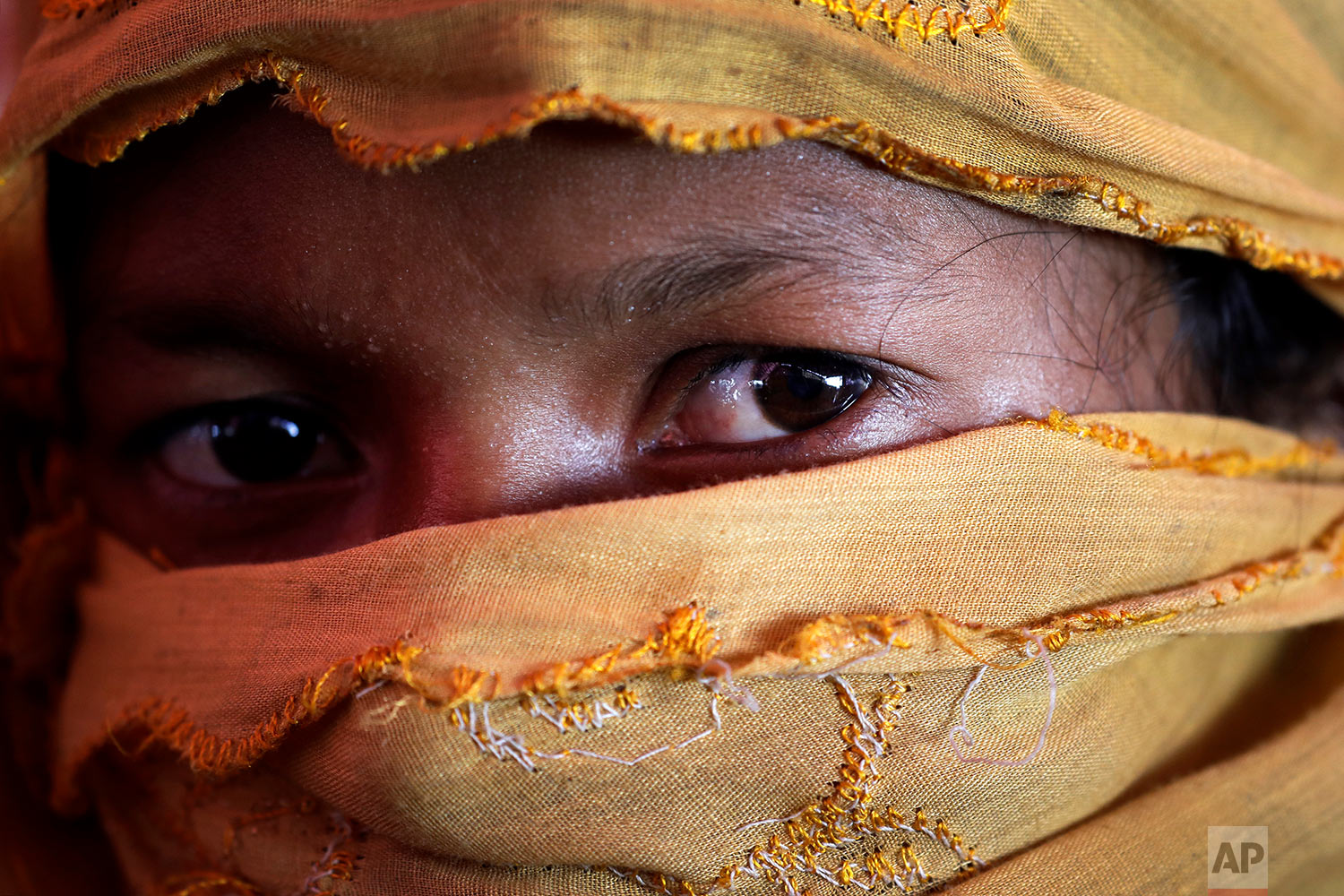  In this Thursday, Nov. 23, 2017, photo, S, 22, mother of one, who says she was raped by members of Myanmar's armed forces in late August, is photographed in her tent in Gundum refugee camp in Bangladesh.  (AP Photo/Wong Maye-E)


 