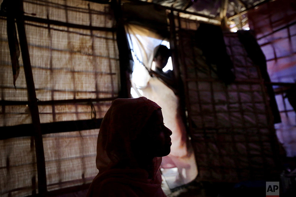  In this Sunday, Nov. 19, 2017, photo, R, 13, is seen in silhouette as she speaks to The Associated Press in her tent in Kutupalong refugee camp in Bangladesh. (AP Photo/Wong Maye-E) 
