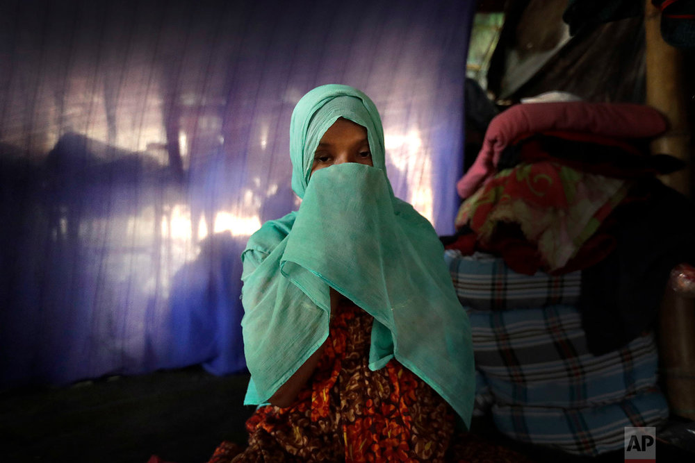  In this Wednesday, Nov. 22, 2017, photo, F, 22, pregnant, prays in her tent in Kutupalong refugee camp in Bangladesh. (AP Photo/Wong Maye-E) 