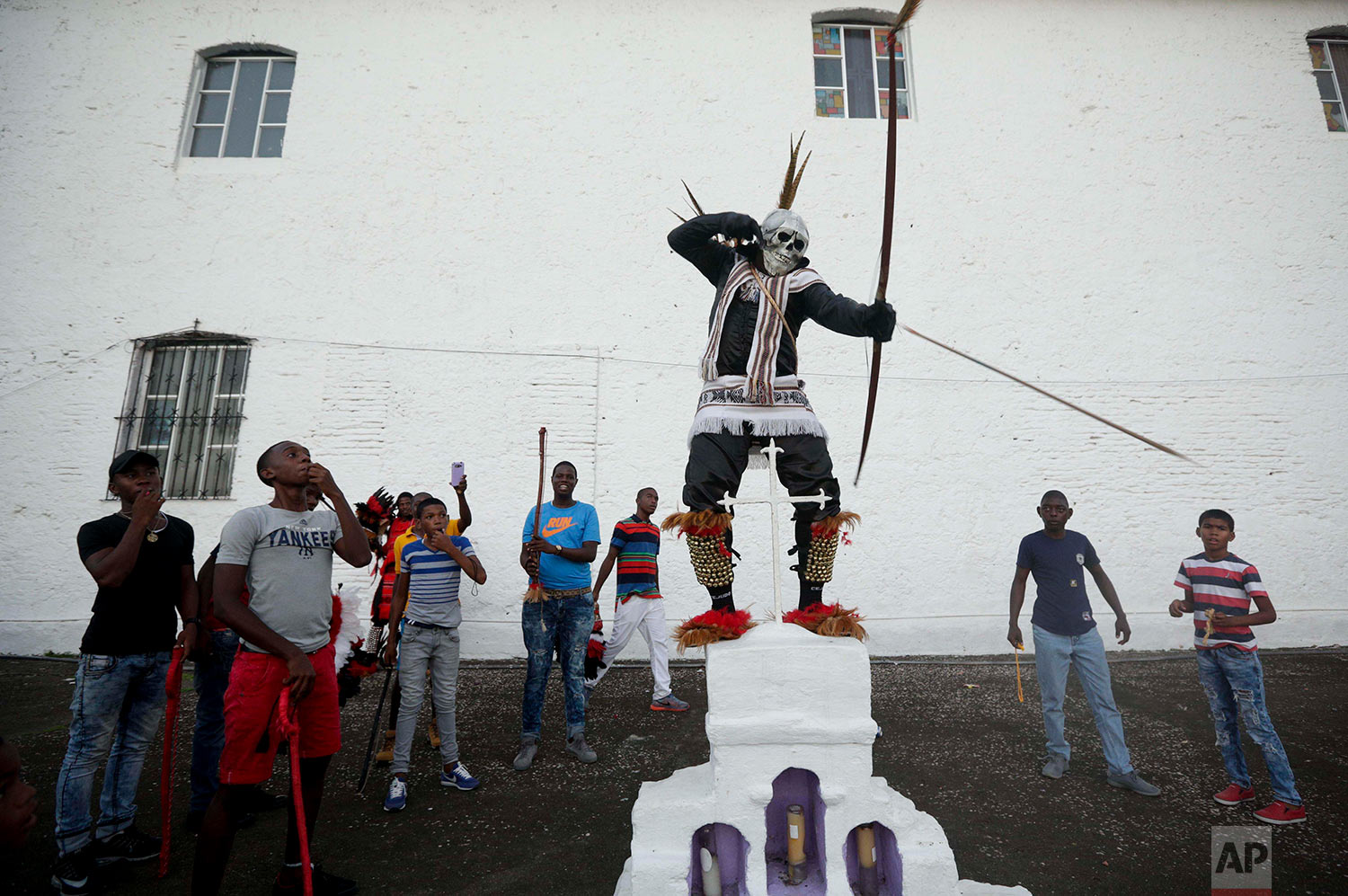 A man dressed as a "devil" performs near the San Felipe church during the Congos and Devils festival in Portobelo, Panama, Saturday, March 18, 2017. The Portobelo festival, a blend of Catholic and African beliefs, was established in 1999 by the community to preserve their culture in honor of their ancestors, who were escaped former slaves from the Congo known as “Cimarrons.” (AP Photo/Arnulfo Franco)