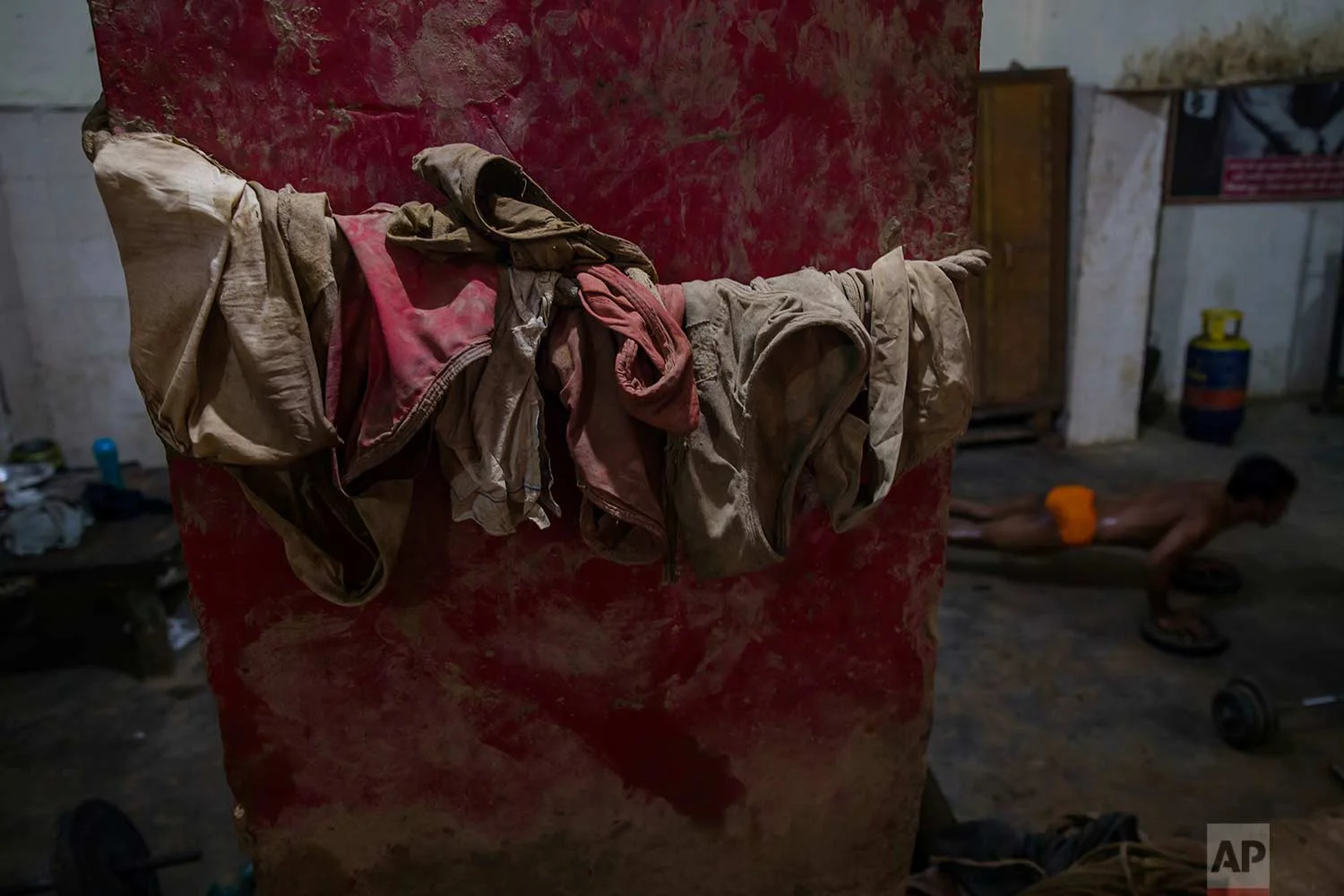 In this Nov. 20, 2017 photo, langots or traditional undergarments worn by Indian kushti wrestlers are seen hanging on a rope at an akhada, a kind of wrestling hostel at Sabzi Mandi, in New Delhi, India. (AP Photo/Dar Yasin)