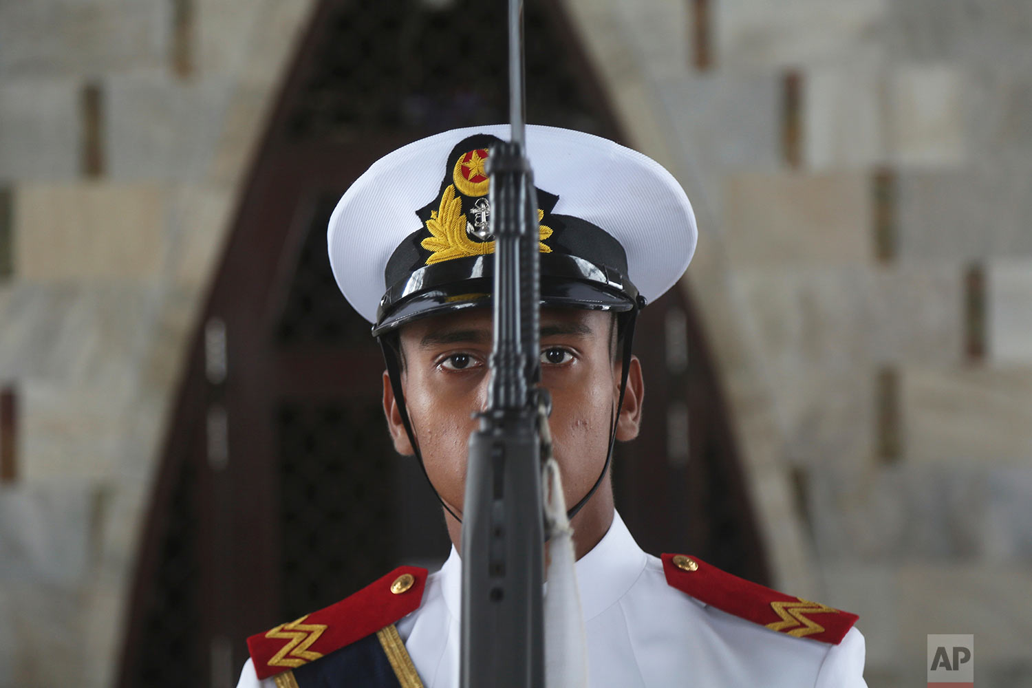 A Pakistani Sailor stands guard at the mausoleum of Muhammad Ali Jinnah, founder of Pakistan during a parade to celebrate the 70th Independence Day in Karachi, Pakistan, Monday, Aug. 14, 2017. Pakistanis commemorated its independence from British colonial rule in 1947. (AP Photo/Shakil Adil)