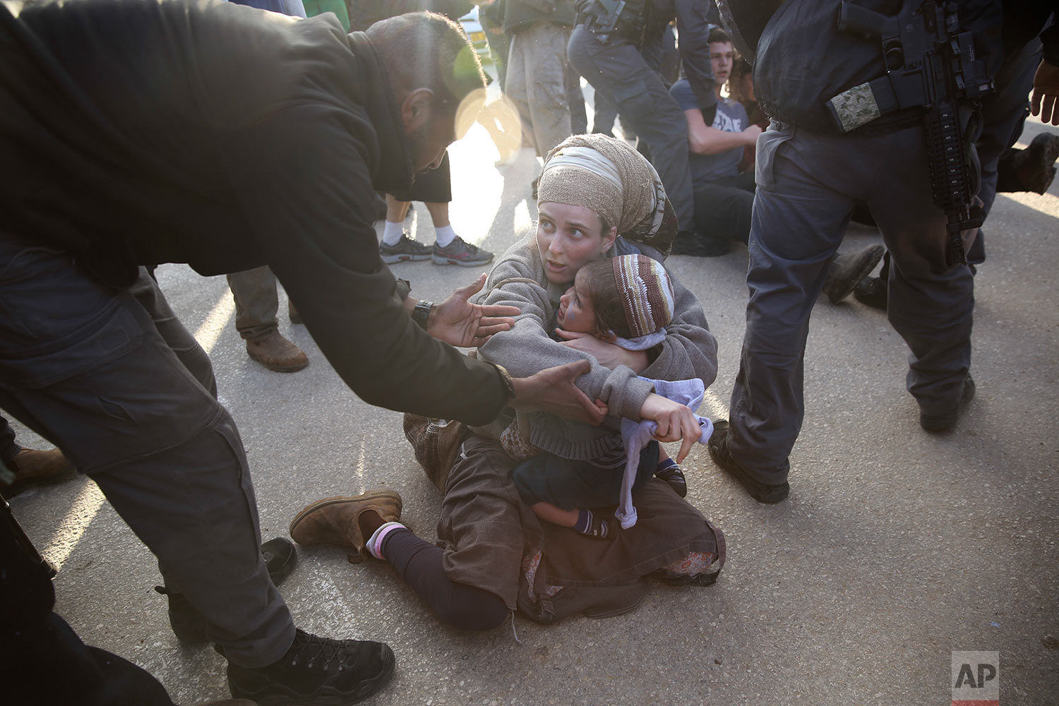 Israeli police evicts settlers from the West Bank settlement of Ofra, following the evacuation of Amona outpost, Thursday, Feb. 2, 2017. Israeli police removed the remaining Israeli protesters from the West Bank outpost of Amona, which forces are evacuating under court order. (AP Photo/Oded Balilty)
