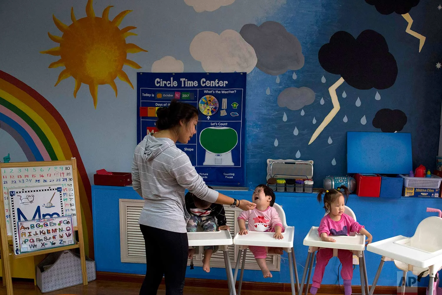 Children attend classes at a foster home of the New Hope Foundation on the outskirts of Beijing, China on Wednesday, Oct. 11, 2017. (AP Photo/Ng Han Guan)