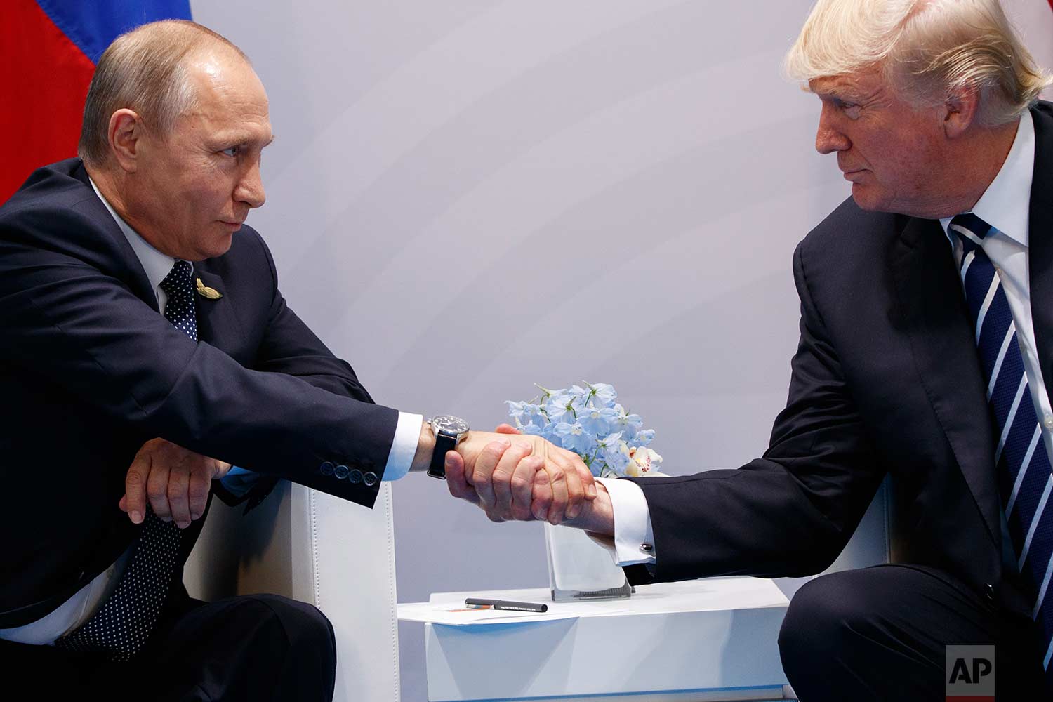  In this Friday, July 7, 2017 photo, President Donald Trump shakes hands with Russian President Vladimir Putin at the G20 Summit in Hamburg. (AP Photo/Evan Vucci) 
