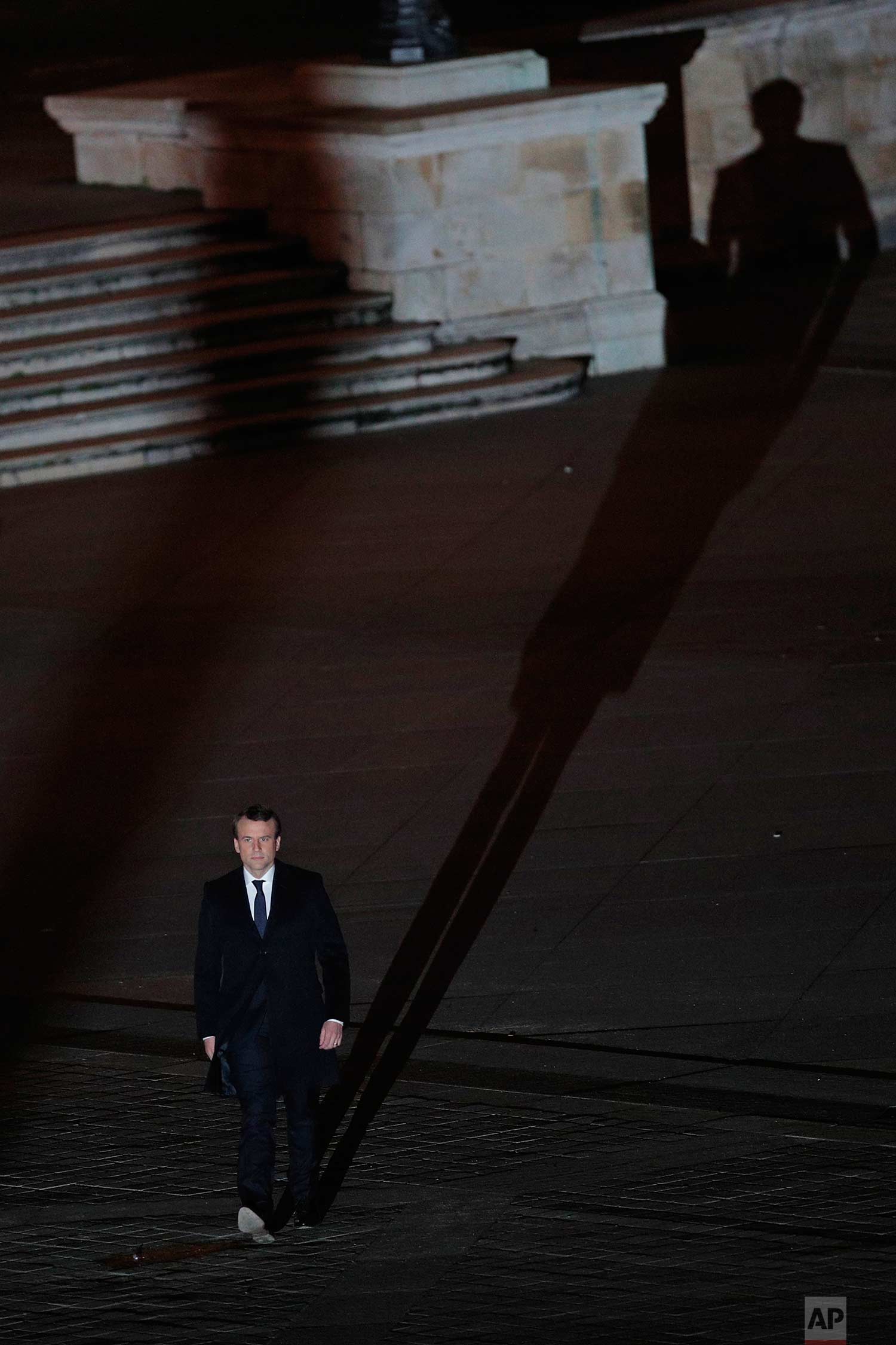  In this Sunday May 7, 2017 photo, incoming French President Emmanuel Macron walks towards the stage to address his supporters at the Louvre Palace in Paris. Polling agencies have projected that centrist Macron will be France's next president, puttin