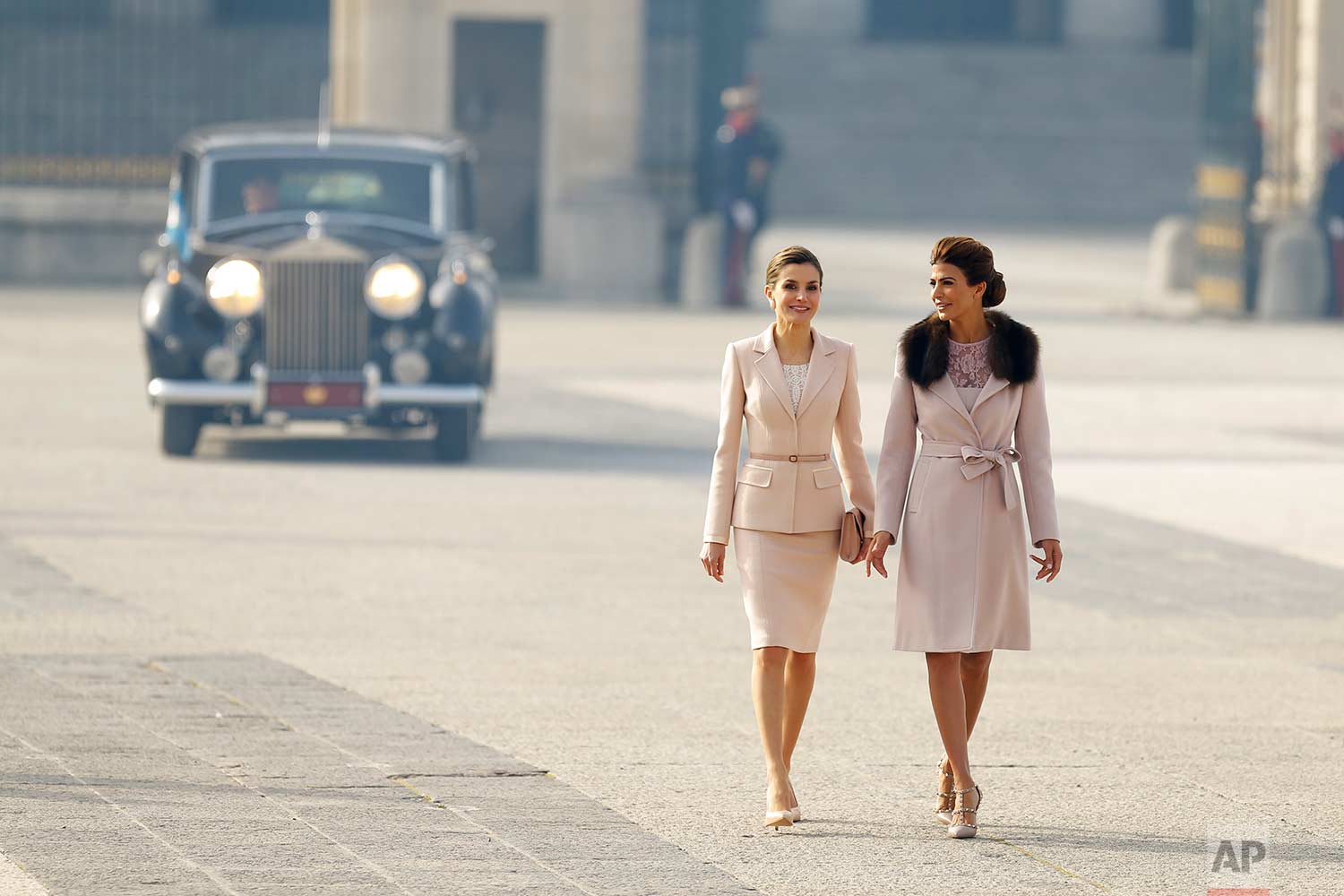  In this Wednesday, Feb. 22, 2017 photo, Spain's Queen Letizia, left, talks to Juliana Awada, the wife of the Argentina's President Mauricio Macri, during a welcome ceremony at the Royal Palace in Madrid. Macri and his wife Awada are on the first of 