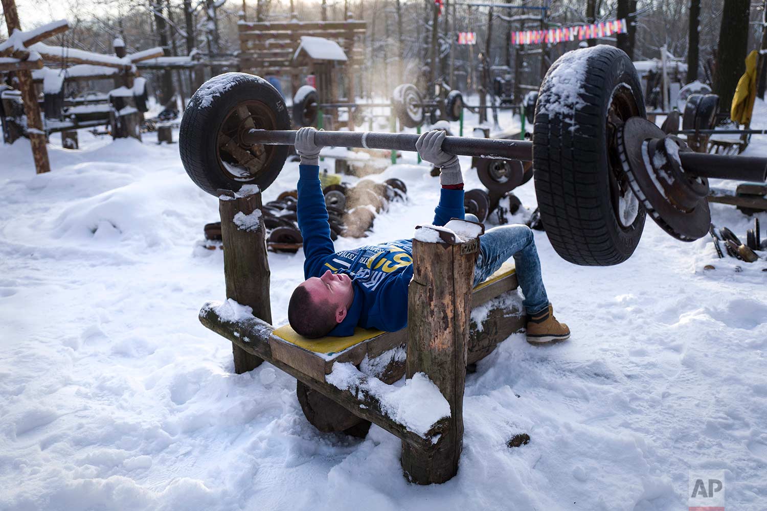  In this Thursday, Jan. 26, 2017 photo, a man trains in the outdoor gym in Timiryazevsky Park in Moscow, Russia. The morning temperature in Moscow is roughly minus -18 degrees Celsius (-0.4 Fahrenheit). (AP Photo/Alexander Zemlianichenko) 