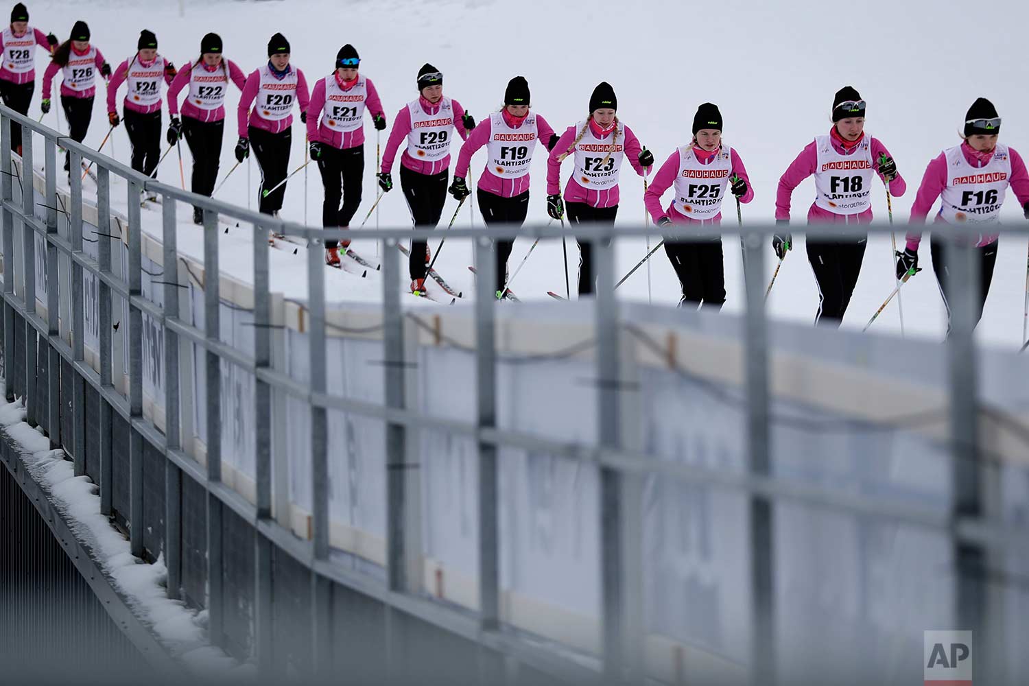  In this Wednesday, Feb. 22, 2017 photo, forerunners prepare the track prior to the women's 5 km cross-country individual classic qualification competition at the 2017 Nordic Skiing World Championships in Lahti, Finland. (AP Photo/Matthias Schrader) 