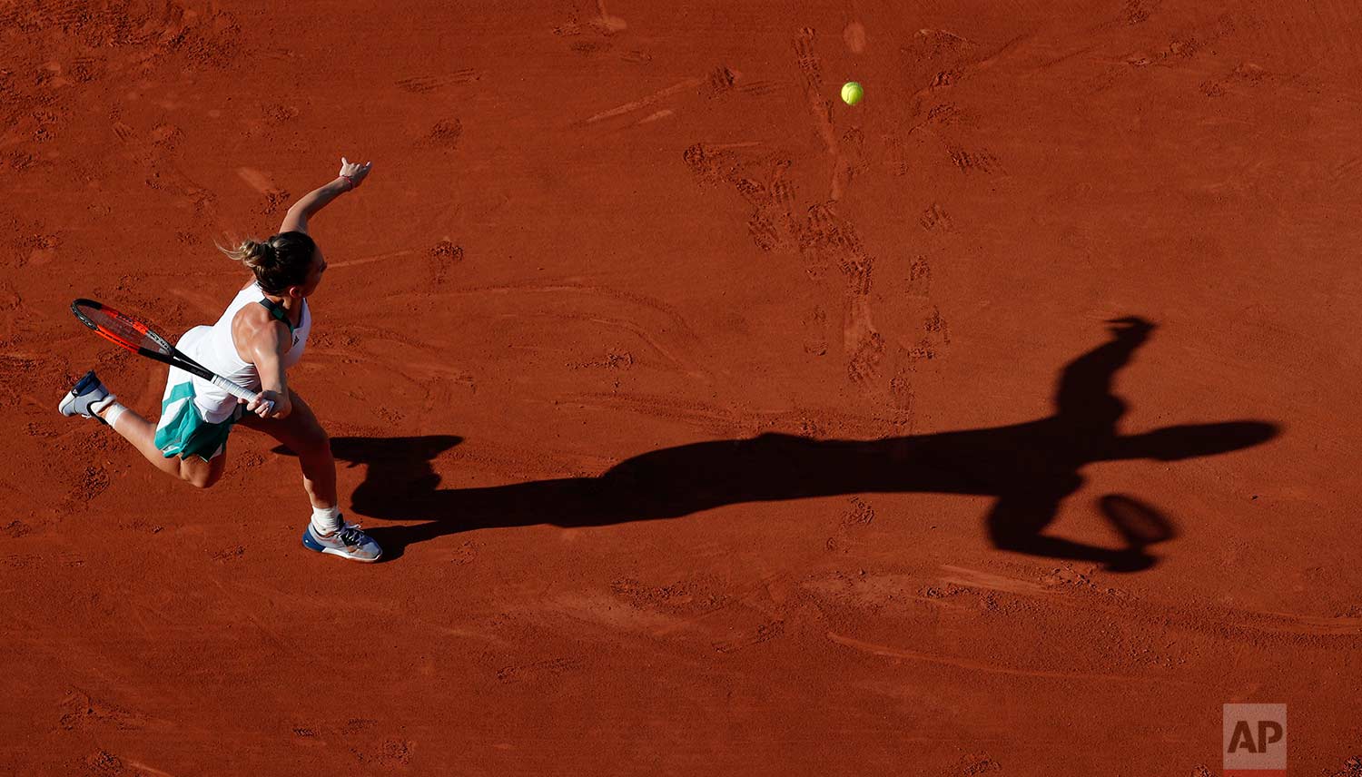  In this Tuesday, May 30, 2017 photo, Romania's Simona Halep reaches for the ball as she plays Slovakia's Jana Cepelova during their first round match of the French Open tennis tournament at the Roland Garros stadium in Paris. (AP Photo/Christophe En