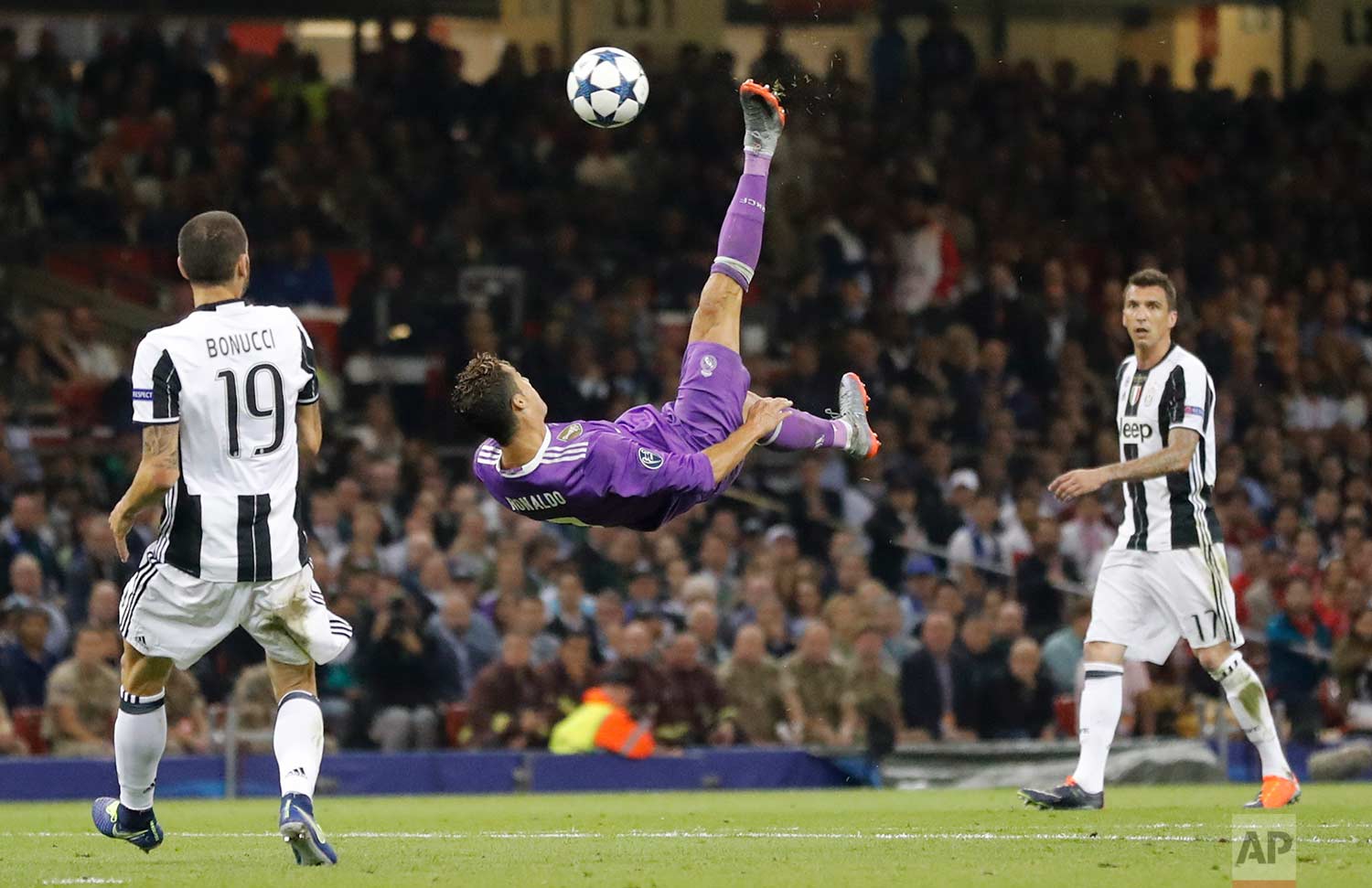  In this Saturday June 3, 2017 photo, Real Madrid's Cristiano Ronaldo connects with an overhead kick during the Champions League final soccer match between Juventus and Real Madrid at the Millennium stadium in Cardiff, Wales. (AP Photo/Frank Augstein