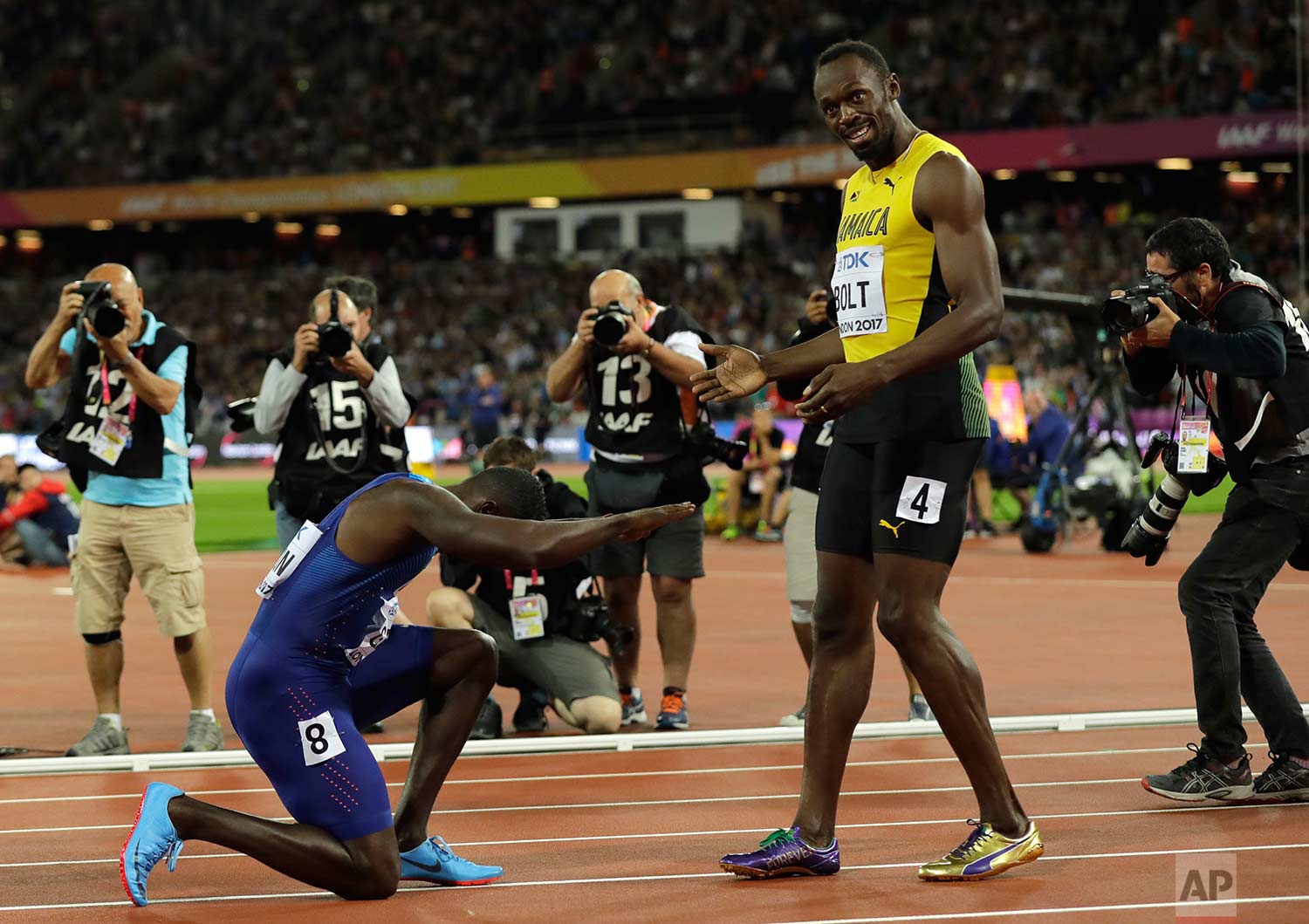  In this Saturday, Aug. 5, 2017 photo, United States' Justin Gatlin bows to Jamaica's Usain Bolt after winning the Men's 100 meters final during the World Athletics Championships in London. (AP Photo/Tim Ireland) 