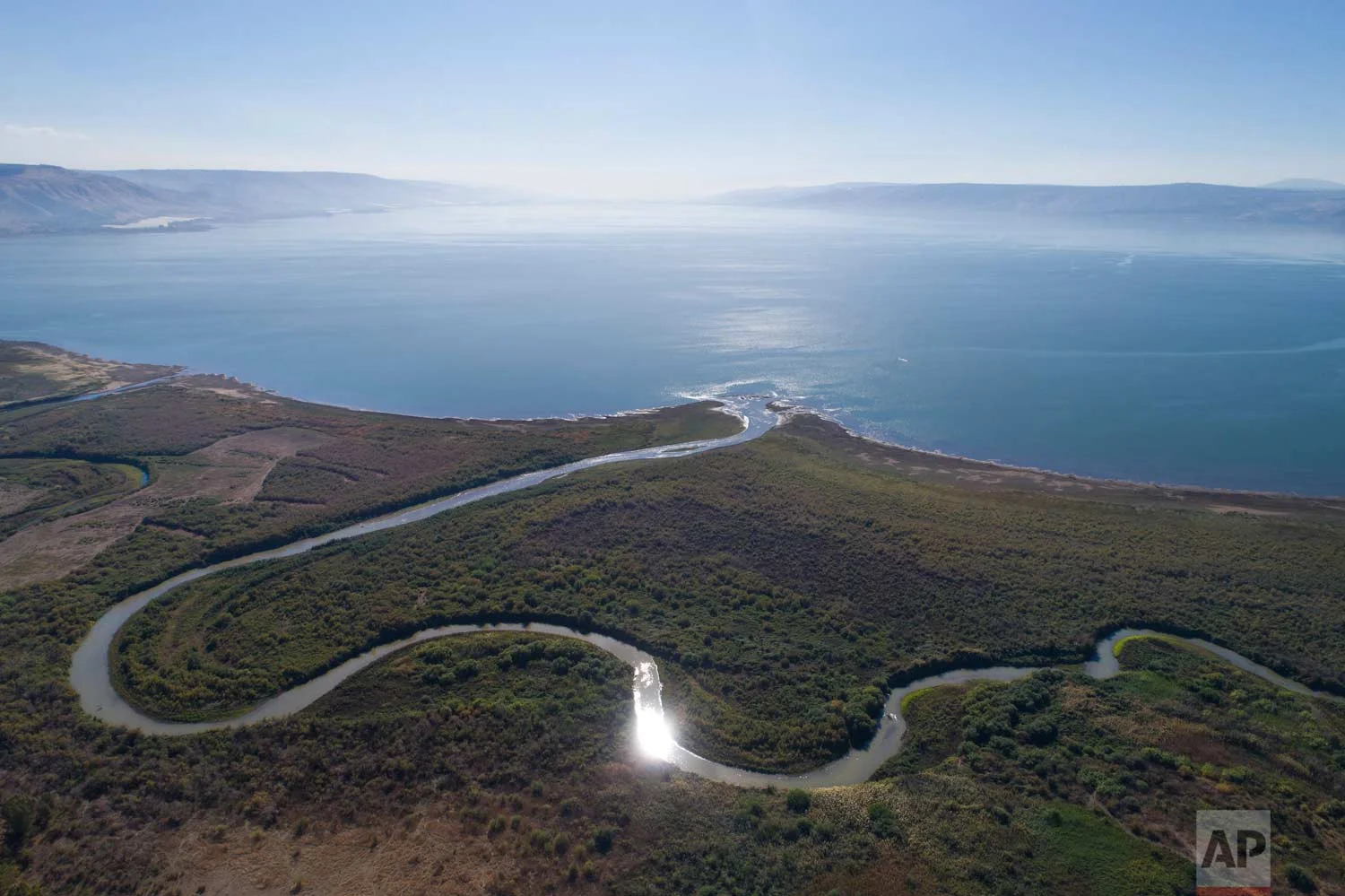 In this Friday, Dec. 8, 2017 photo, an aerial view shows the Jordan River estuary of the Sea of Galilee near the community settlement of Karkom, northern Israel. (AP Photo/Oded Balilty)