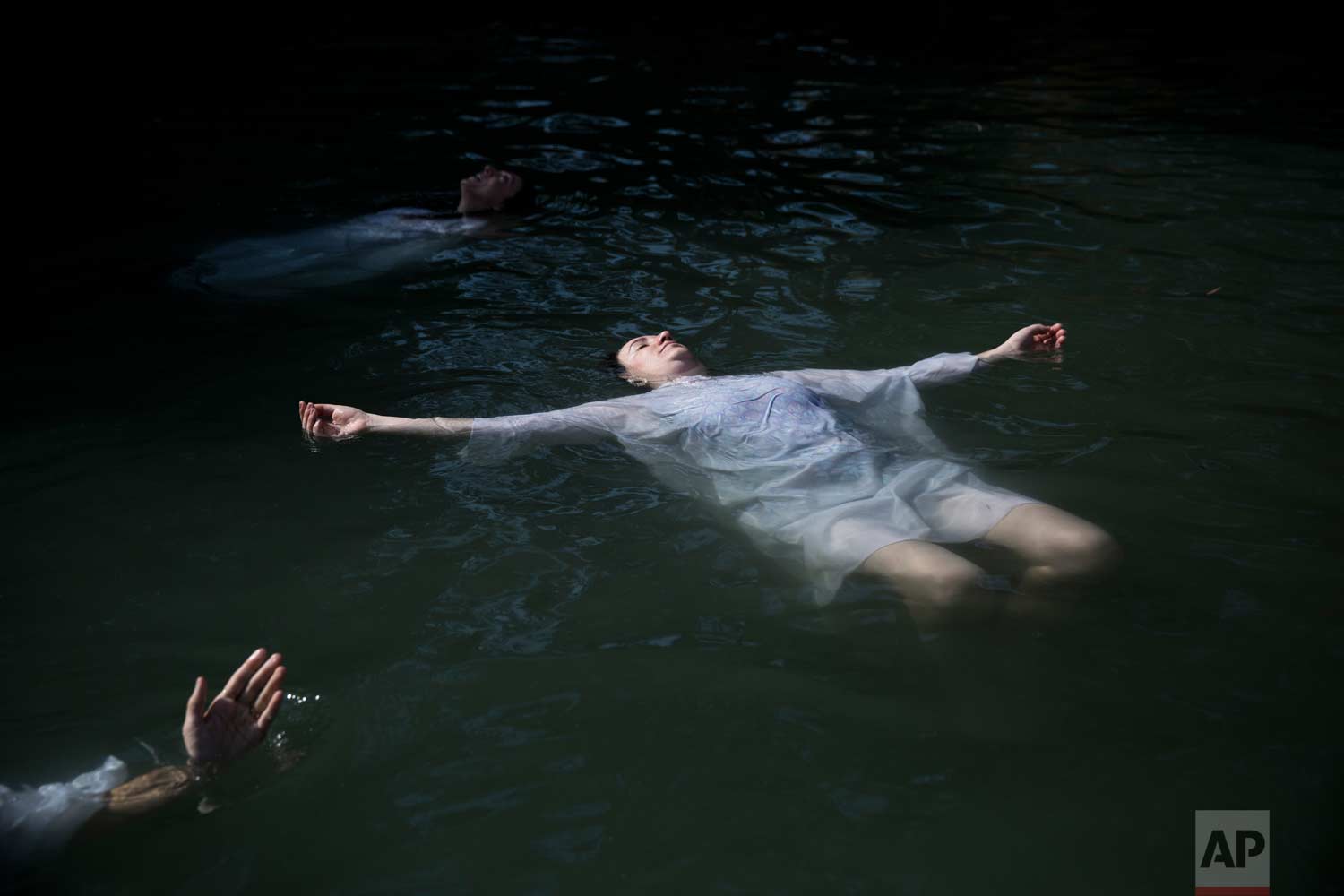  In this Tuesday, June. 20, 2017 photo, Christian pilgrims baptize in the Jordan River at Yardenit baptismal site in northern Israel. (AP Photo/Oded Balilty) 