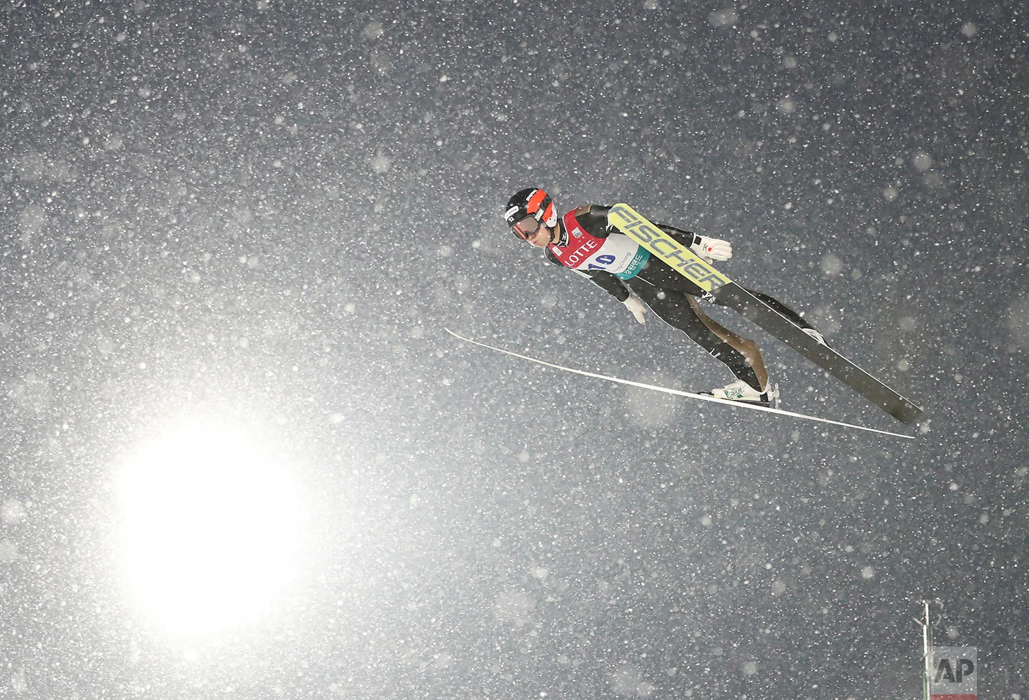 Japan's Aguri Shimizu soars through the air during the Individual Gundersen LH / 10 km event of the FIS Nordic Combined World Cup competition in Pyeongchang, South Korea, Sunday, Feb. 5, 2017. The World Cup competition is also a test event for the PyeongChang 2018 Winter Olympics. (AP Photo/Lee Jin-man)