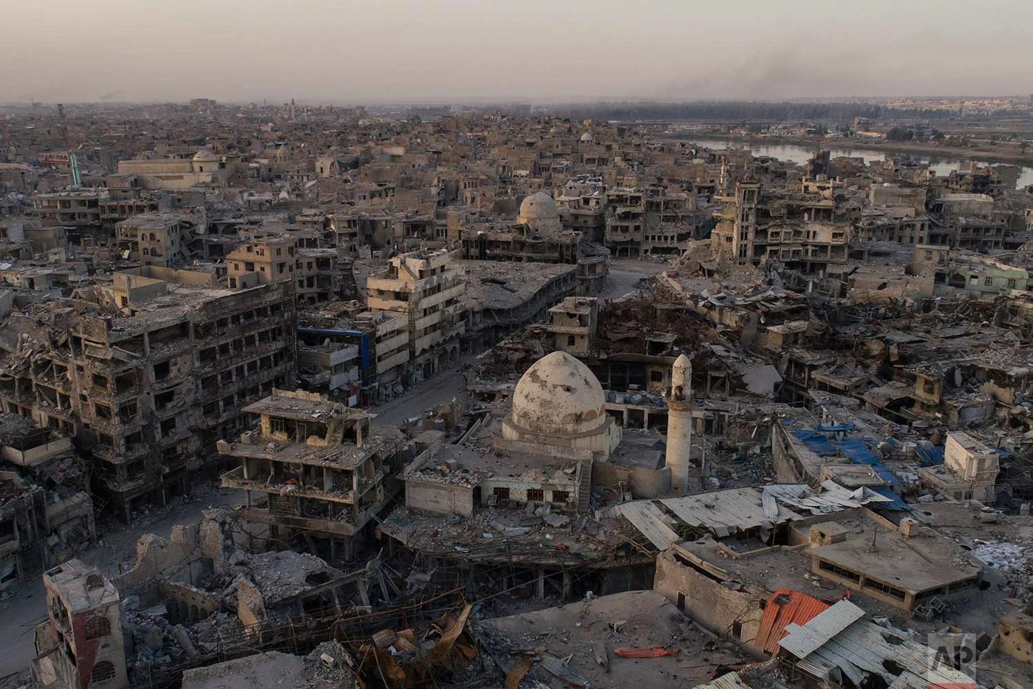 In this Nov. 15, 2017 photo, aerial view of destroyed building and shops in the Old City of Mosul, Iraq. (AP Photo/Felipe Dana)